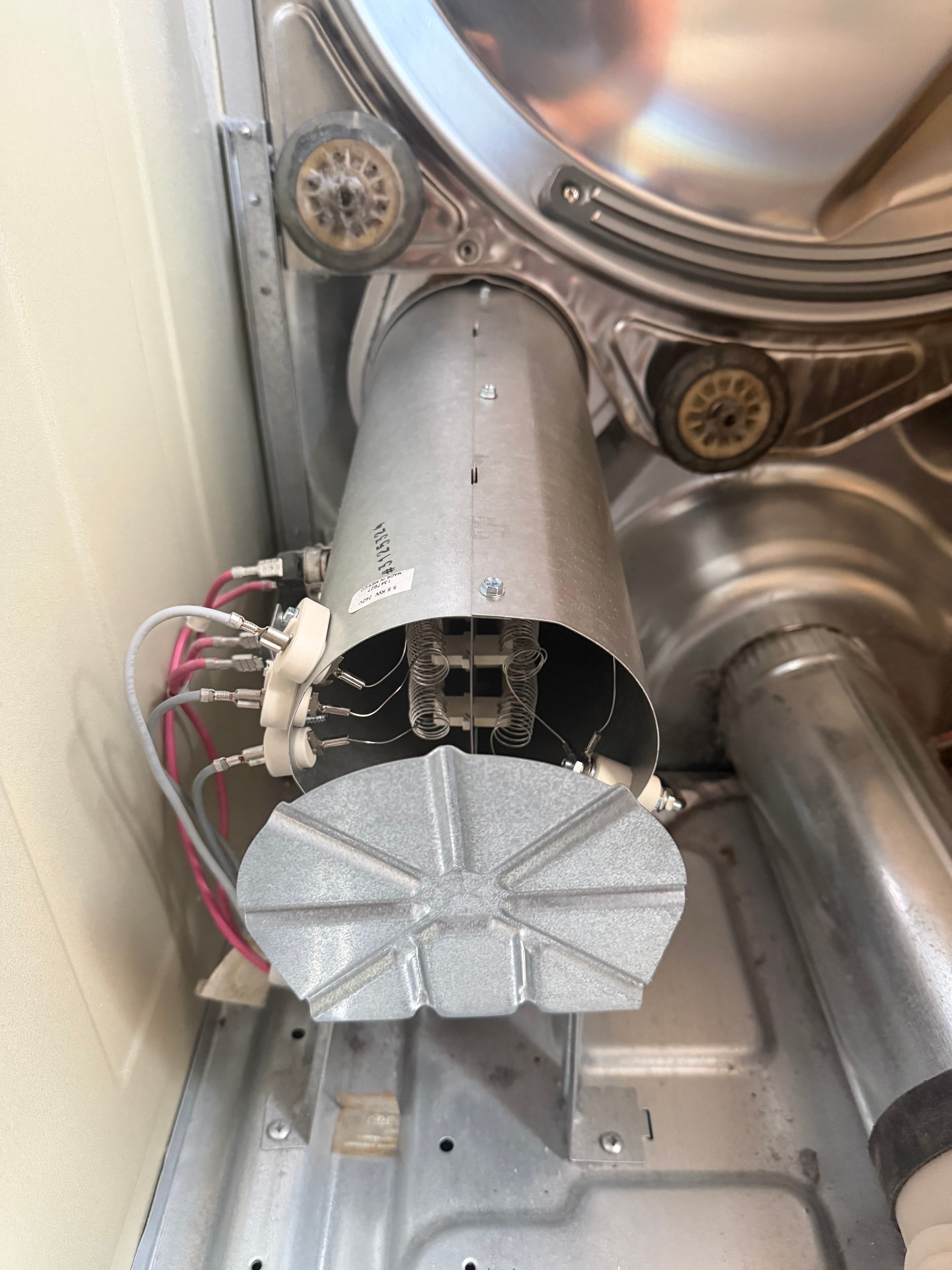 New OEM Electrolux heating element assembly installed in dryer — Denver repair complete