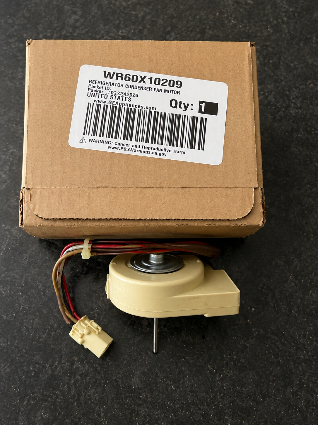 OEM GE condenser fan motor Part WR60X10209 in original GE Appliances packaging — Englewood, CO refrigerator repair