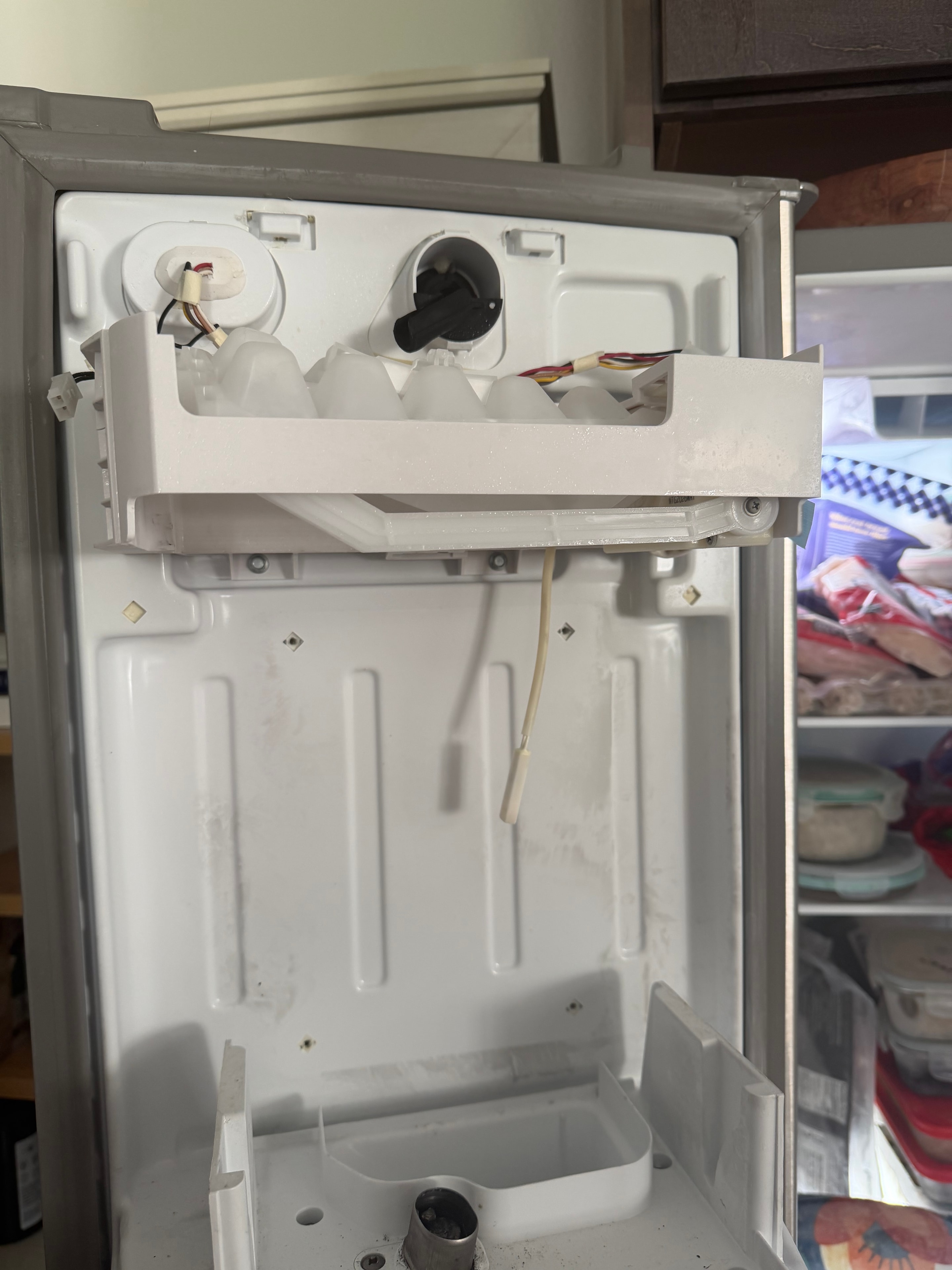 Whirlpool ice maker assembly exposed for diagnosis — Skyland Denver refrigerator repair