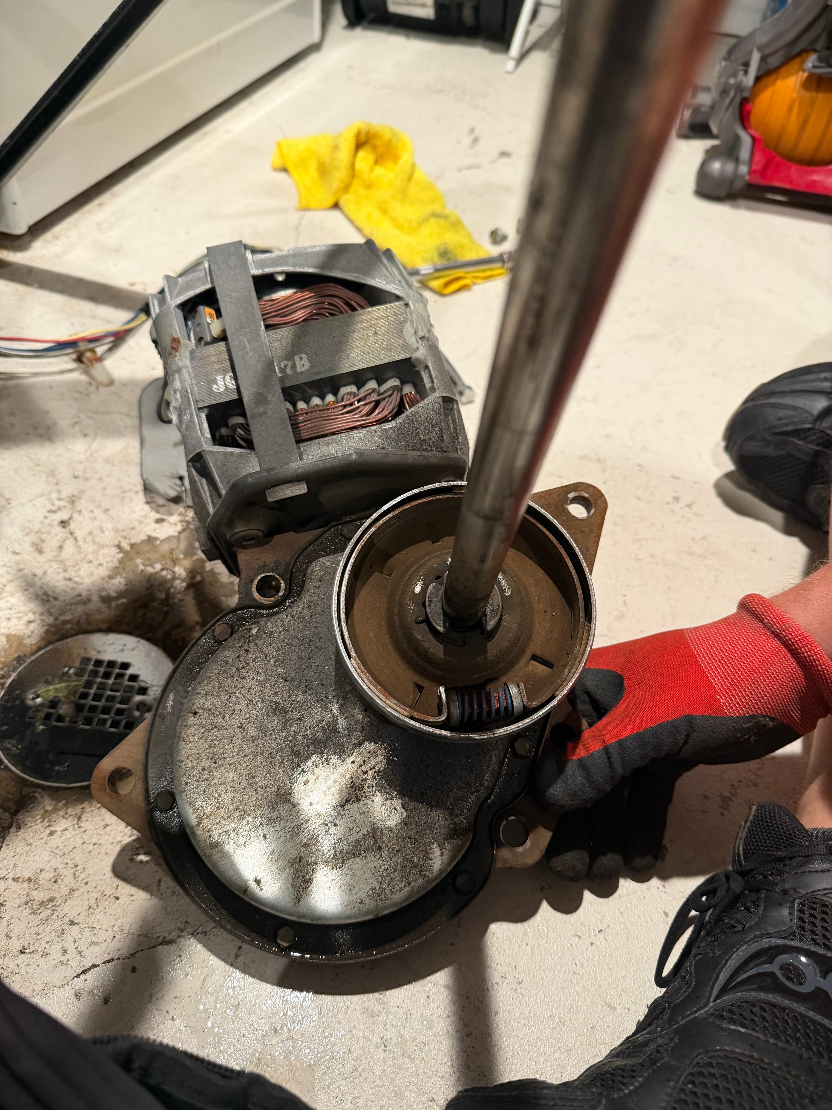 Rusted and grease-contaminated clutch assembly on Whirlpool direct-drive washer